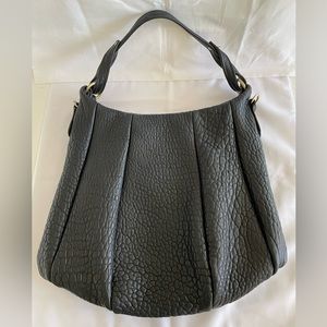 Opelle Lotus in shrunken lamb